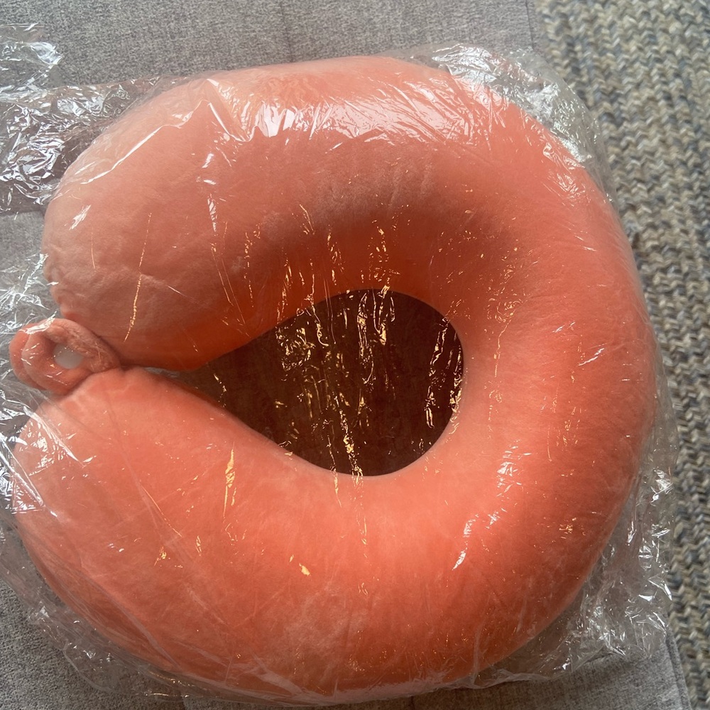 Light orange comfy cozy memory foam travel pillow with snap closure